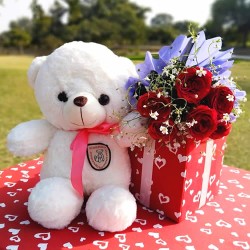 Cute teddy with beautiful flowers