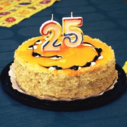 Mango cake with number candles