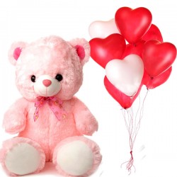 Teddy bear with blown balloons