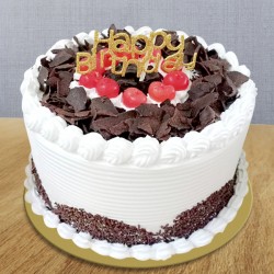 Black forest cake with happy birthday topper