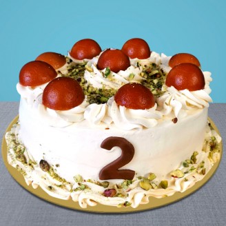 Cake with gulab jamun and pista on top Online Cake Delivery Delivery Jaipur, Rajasthan