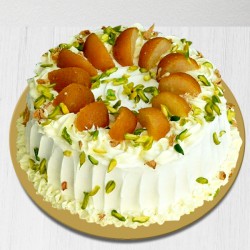 Cake with pista and gulab jamun topping