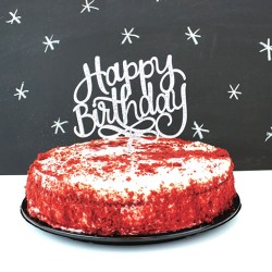 Red velvet cake with happy birthday topper
