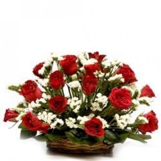 Red roses with fillers in a basket Delivery Jaipur, Rajasthan